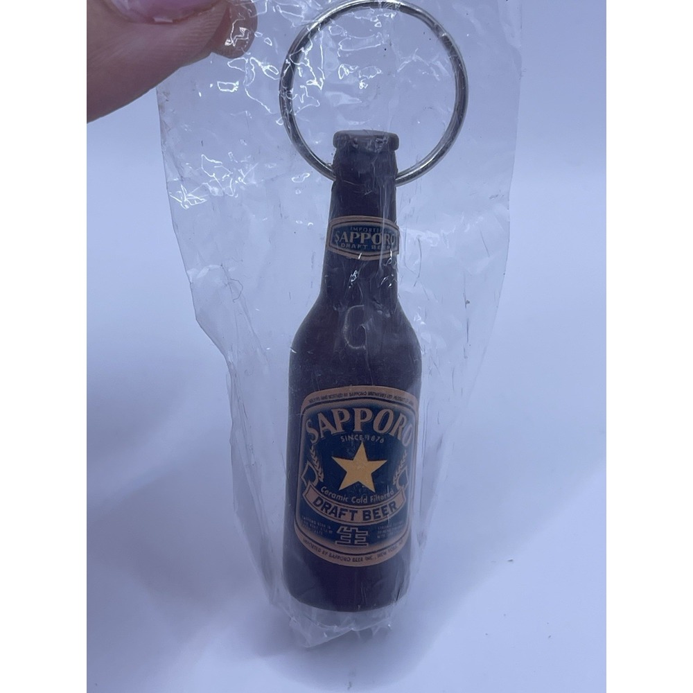 SAPPORO, PREMIIUM BEER. JAPANS OLDEST BRAND. SOUVENIR KEYCHAIN BOTTLE OPENER.